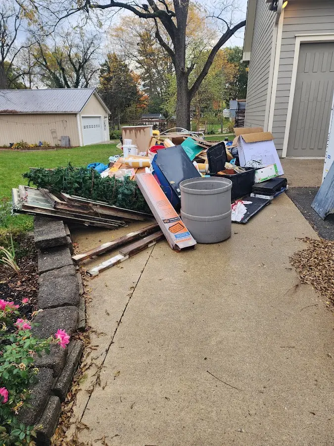 Dumpster being loaded with debris for 30 Yard Dumpster Rental in St. Marys